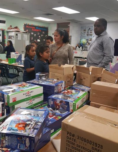 Girls checking the toys and boxes