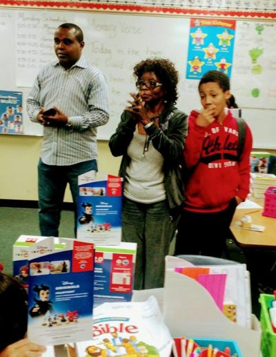 Adults and kids near the boxes of toys