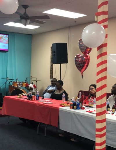 Tables decorated with hearts and red balloons