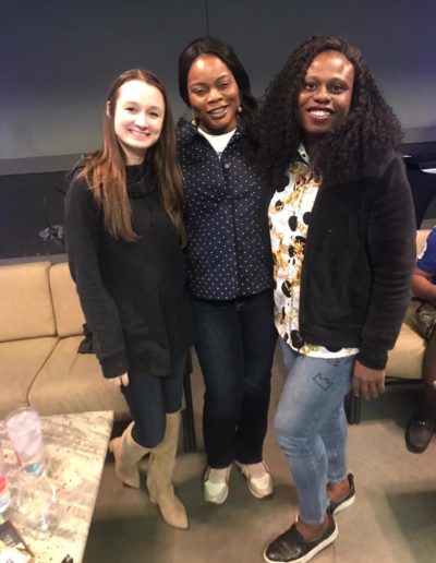 A group picture of three happy women