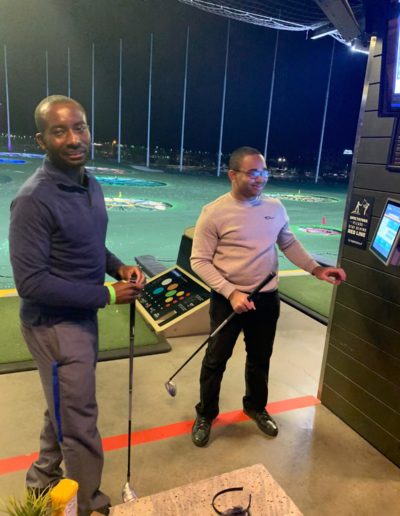 Two men about to play golf