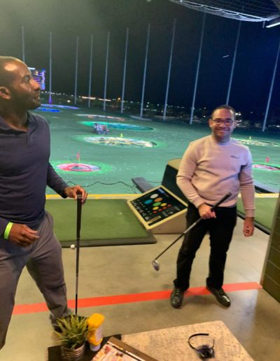 Two happy men about to play a golf game