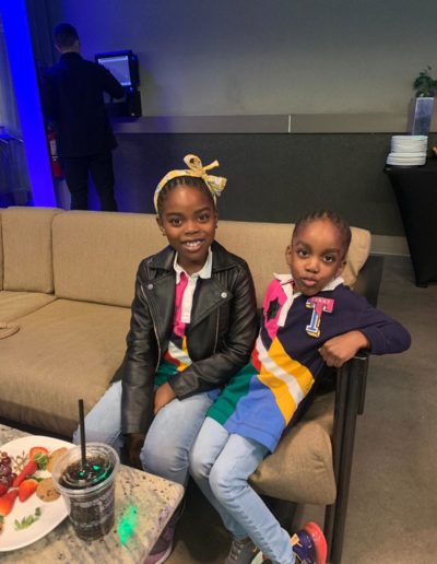 Two girls sitting on a sofa