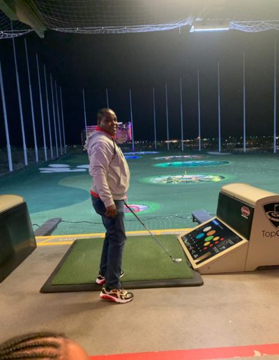 A man approaching the golfing platform