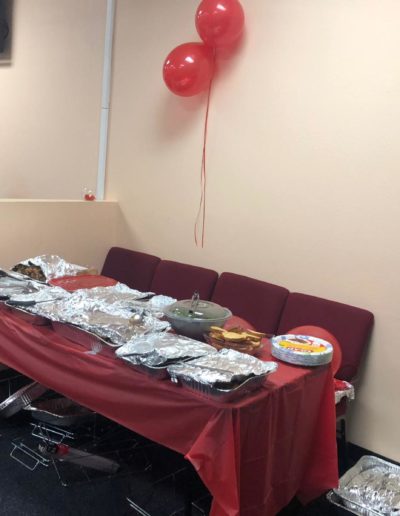 Food in covered trays on the table